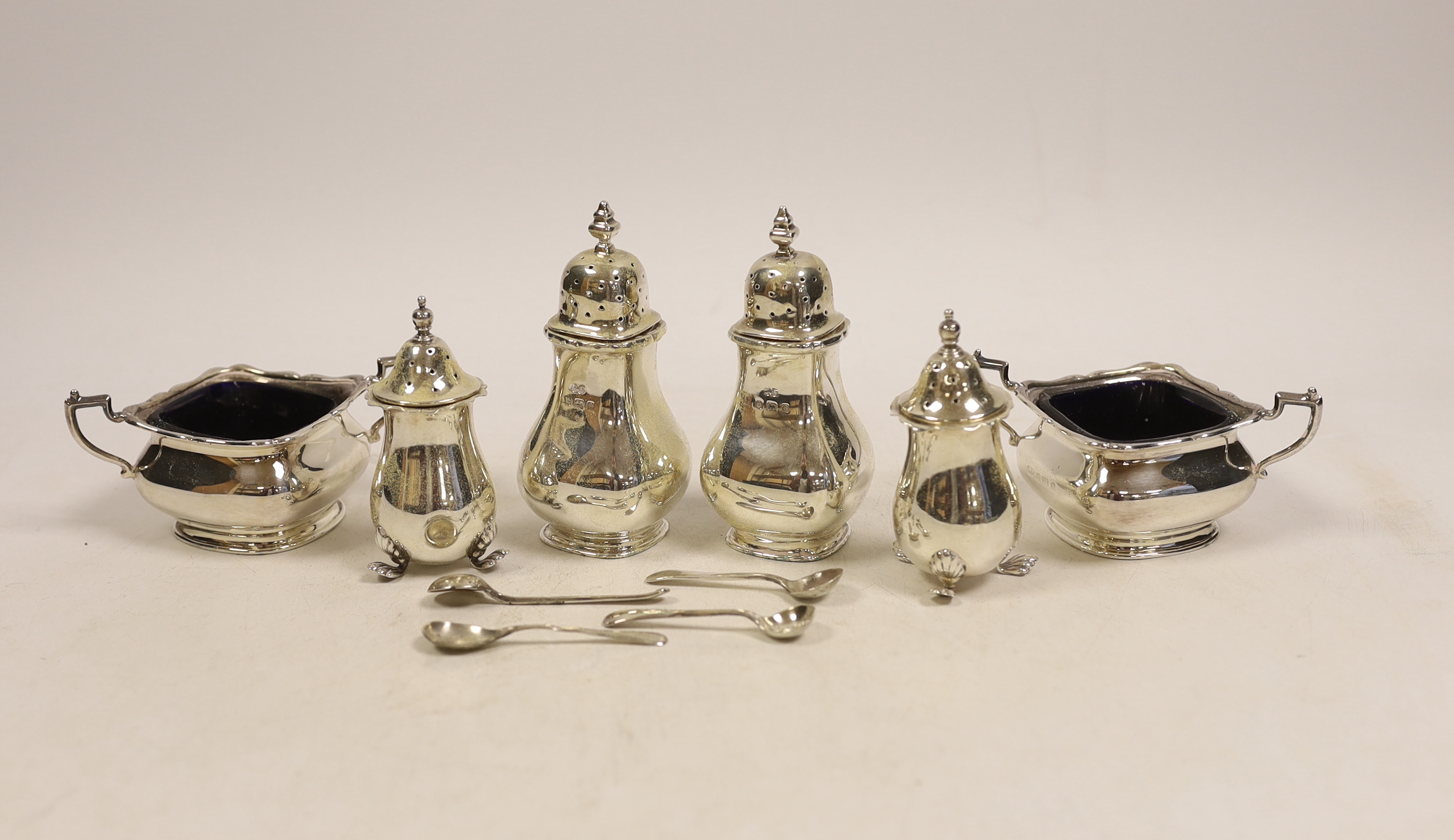 A silver condiment set comprising two salts, two peppers, two pepperettes and four spoons, Birmingham, 1904.